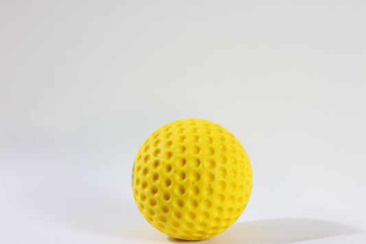 Yellow Crikon Dimple Cricket Ball with aerodynamic dimple design for swing and pace practice